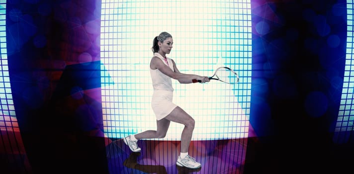 Athlete playing tennis with a racket  against background of blue squares