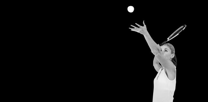 Athlete holding a tennis racquet ready to serve on white background