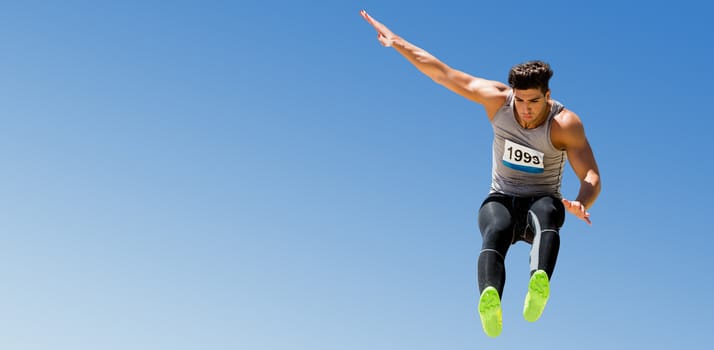 Sportsman jumping on a white background against scenic view of blue sky