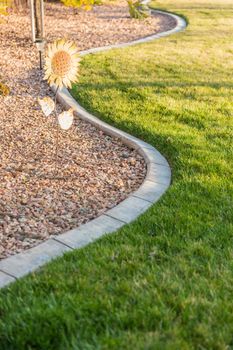 Beautiful Concrete Coping Along Lush Green Grass in Yard.