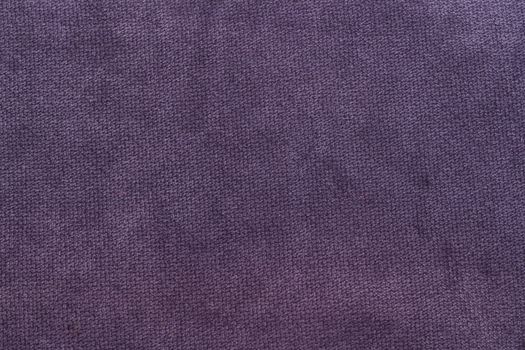 The Velvet fabric texture in purple color.