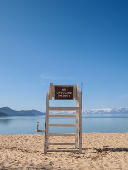 lifeguard chair stand on the shore of lake Tahoe. 