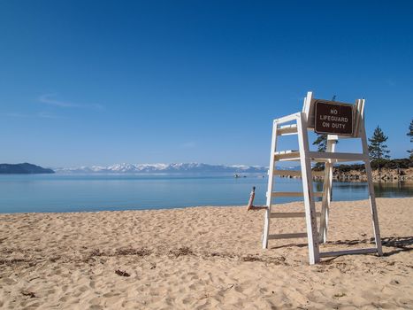 lifeguard chair stand on the shore of lake Tahoe. 