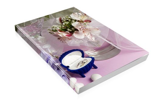 book  of  wedding rings and wedding favors on a colorful background