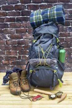 Hiking equipment, rucksack, boots and backpack. Concept for family hiking. Colorful background.