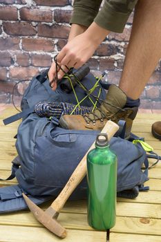 Hiking equipment, rucksack, boots and backpack. Concept for family hiking. Colorful background.