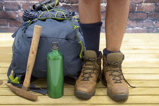 Hiking equipment, rucksack, boots and backpack. Concept for family hiking. Colorful background.