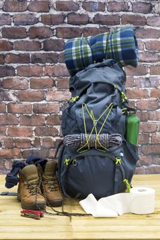 Hiking equipment, rucksack, boots and backpack. Concept for family hiking. Colorful background.