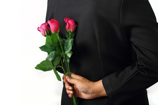 Woman making proposal with rose flowers isolated on white background.