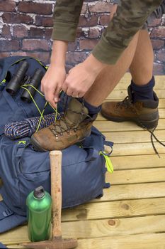 Hiking equipment, rucksack, boots and backpack. Concept for family hiking. Colorful background.