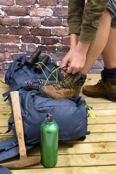 Hiking equipment, rucksack, boots and backpack. Concept for family hiking. Colorful background.