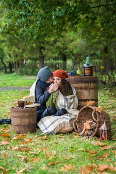 loving couple sitting in the autumn garden