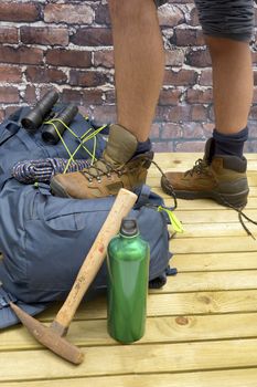 Hiking equipment, rucksack, boots and backpack. Concept for family hiking. Colorful background.