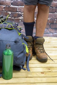 Hiking equipment, rucksack, boots and backpack. Concept for family hiking. Colorful background.