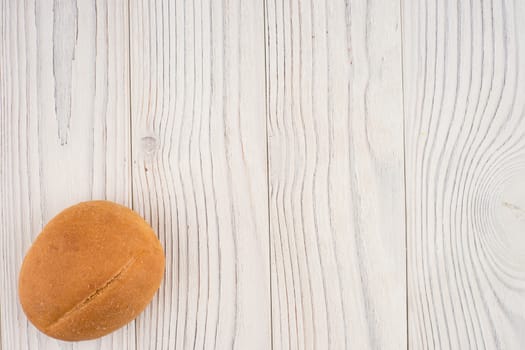 Hamburger buns on white old wooden table. Top view.