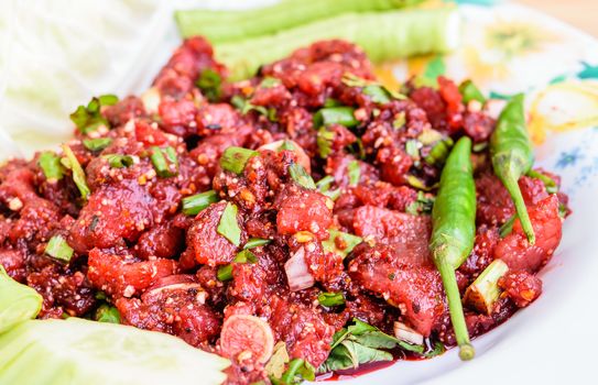 raw minced meat for thai food on a plate