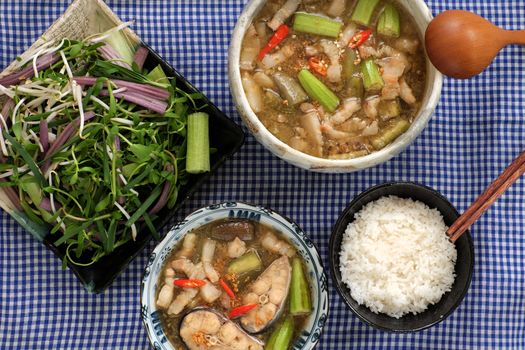 Vietnamese food, mam kho, a featured meal of Mekong Delta, Vietnam. Raw material to cook are basa fish, shrimp, bacon, citronella, garlic, chilli , eat this dish with cooked rice and vegetable