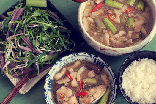 Vietnamese food, mam kho, a featured meal of Mekong Delta, Vietnam. Raw material to cook are basa fish, shrimp, bacon, citronella, garlic, chilli , eat this dish with cooked rice and vegetable