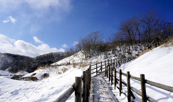 Noboribetsu onsen and walkway bridge snow winter national park in Jigokudani, Hokkaido, Japan