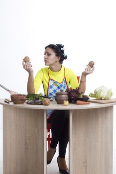 Housewife is preparing in the kitchen on a white background