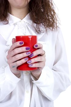 Orange ceramic cup of coffee in female hands