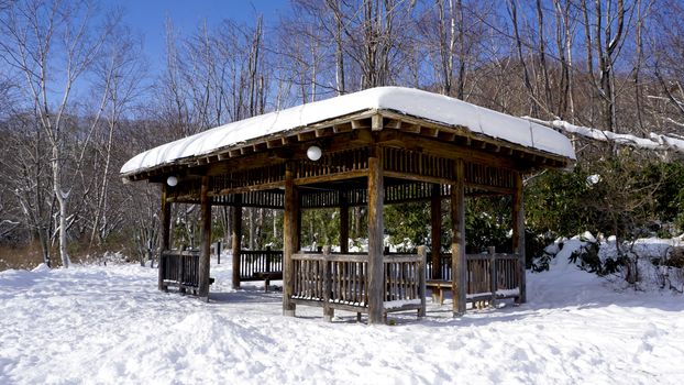 Snow and wooden pavilion environment in the forest Noboribetsu onsen snow winter national park in Jigokudani, Hokkaido, Japan