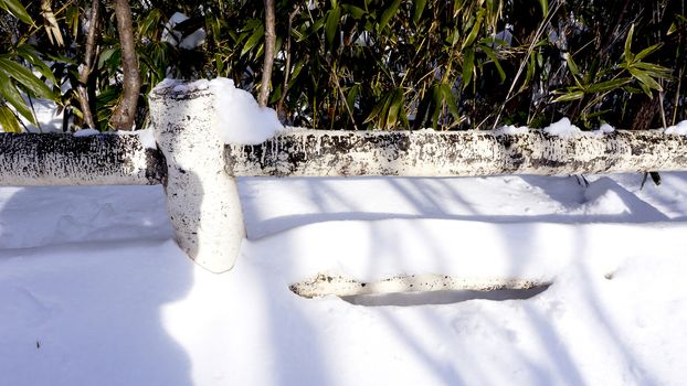 Closeup Snow and railing in the walkway forest Noboribetsu onsen snow winter national park in Jigokudani, Hokkaido, Japan