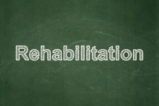 Healthcare concept: text Rehabilitation on Green chalkboard background