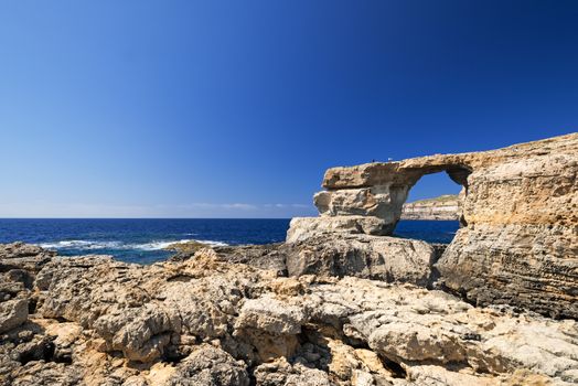 Azure Window, famous stone arch of Gozo island in the sun in summer, Malta