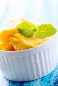 Passion fruit sherbet with mint leaves