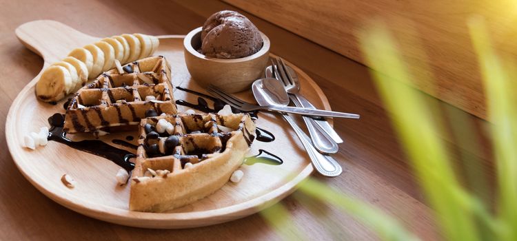 Belgian waffles with fruit and chocolate, forest fruit, all homemade, delicious batter