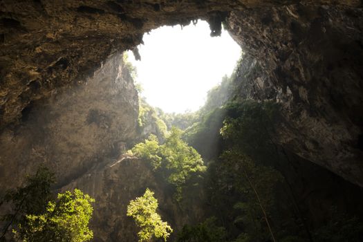 Sunlight through a cave hole in Thailand
