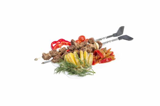 Kebabs grilled meat tomatoes and vegetables on white background 