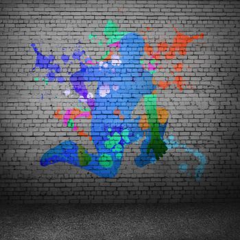 Image with color silhouette of dancer on gray wall