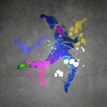 Image with color silhouette of dancer on gray wall