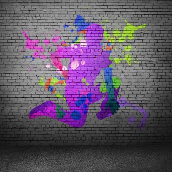 Image with color silhouette of dancer on gray wall