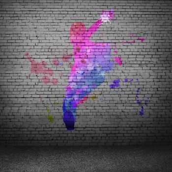 Image with color silhouette of dancer on gray wall