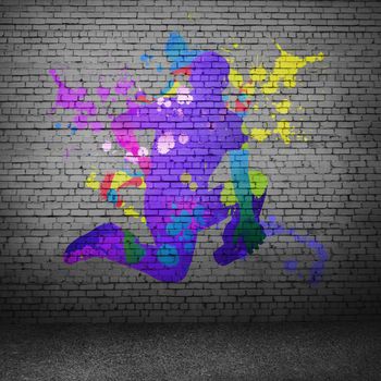 Image with color silhouette of dancer on gray wall