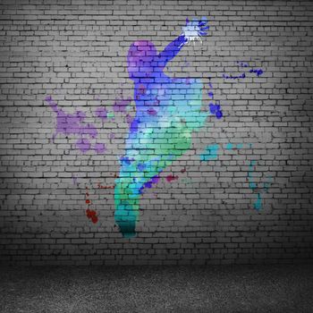 Image with color silhouette of dancer on gray wall