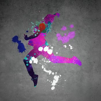 Image with color silhouette of dancer on gray wall