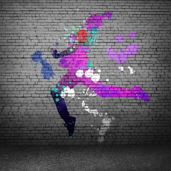 Image with color silhouette of dancer on gray wall