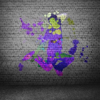 Image with color silhouette of dancer on gray wall