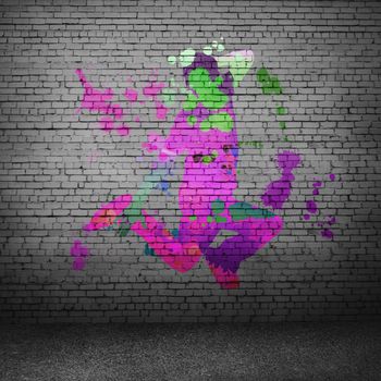 Image with color silhouette of dancer on gray wall