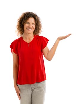 Portrait of a smiling middle aged showing something on her hand