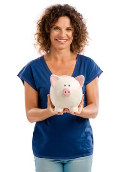 Portrait of a happy middle aged woman holding a Piggybank