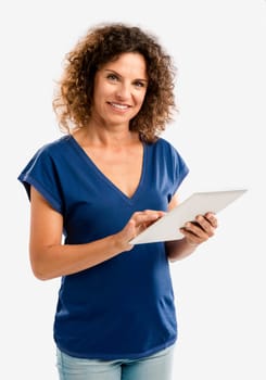 Beautiful middle aged woman working on a tablet