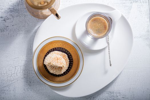 Coffee and handmade almond cookies on a plate