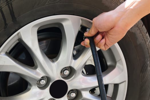 inflating the automobile wheels via a pump.