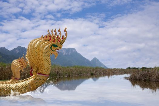 Nine head of serpent statue in Wat Thailand. A Buddhist religious belief. Animals imagination in fairy tale.