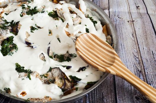 baked pasta with eggplant, bread and parmesan cheese